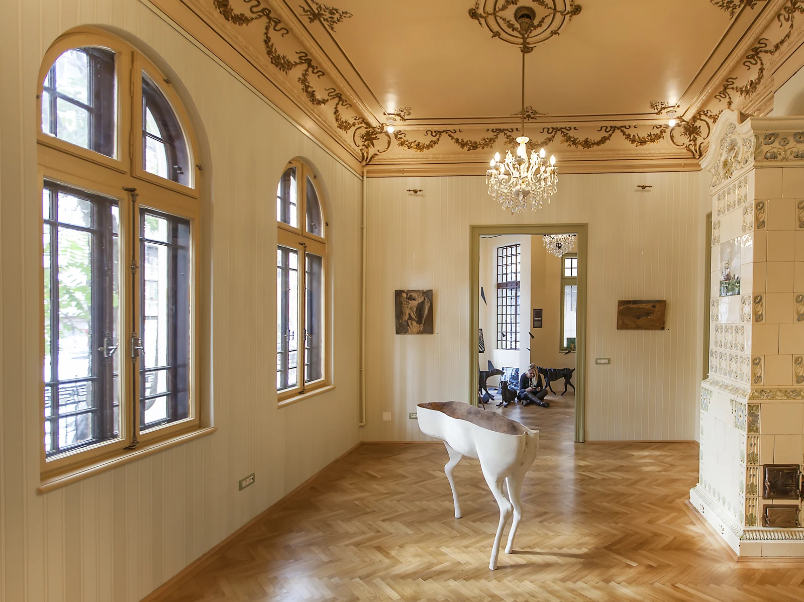 Art extending through the workplace as a continuous cultural presence.