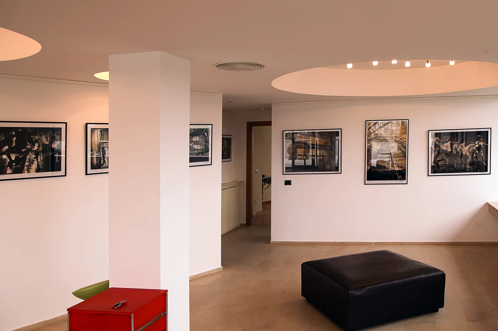 Framed fine-art photography distributed throughout the rooms created a coherent visual programme.